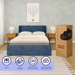 Full-size 10-inch cooling comfort mattress-in-a-box on a blue upholstered platform bed in a modern bedroom with wooden nightstands, table lamps and hot air balloon wall art — unbox, unroll & expand, allow 24 hours for full recovery