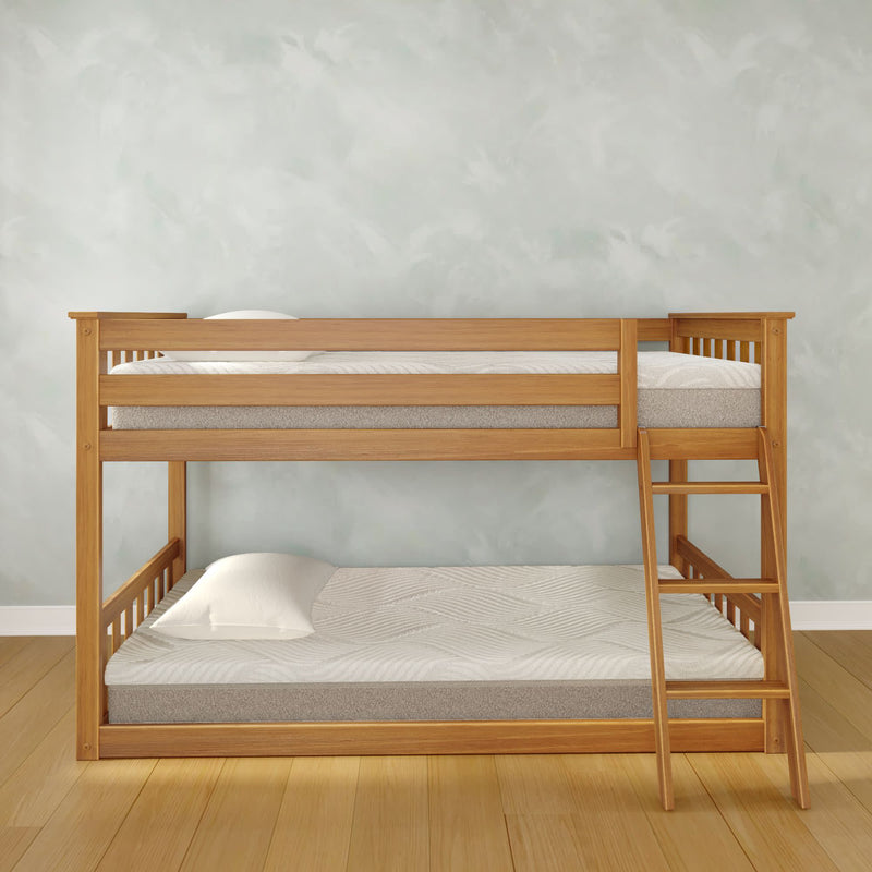 Light oak wooden bunk bed with ladder, white mattresses and pillows in a minimal bedroom with pale textured wall and hardwood floor