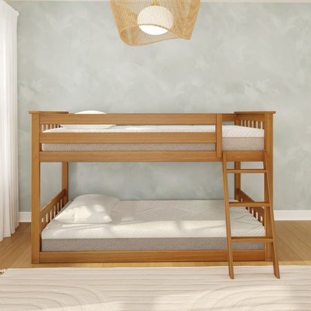 Natural wood bunk bed for kids with ladder, white mattresses and pillow in a bright minimalist bedroom with hardwood floor and pale green textured wall